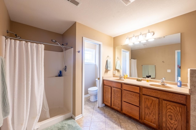 1715 W River St Unit 1715, Dixon, IL 61021 - full bathroom featuring double vanity, a shower with shower curtain, and tile patterned flooring