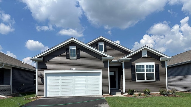 2295 Tupelo Way, Wonder Lake, IL 60097 - view of front of house with asphalt driveway, a front lawn, and an attached garage