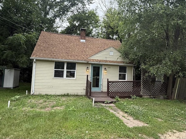 1356 Willard Ave, Rockford, IL 61101 - bungalow-style house with a chimney, a storage unit, and a shingled roof