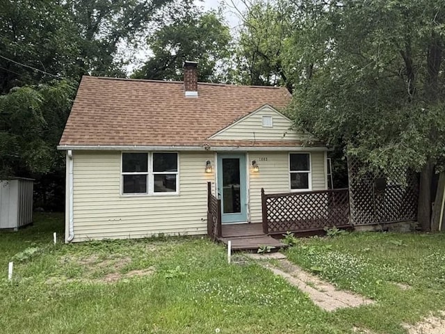 1356 Willard Ave, Rockford, IL 61101 - view of front of property featuring a front lawn, a chimney, and roof with shingles