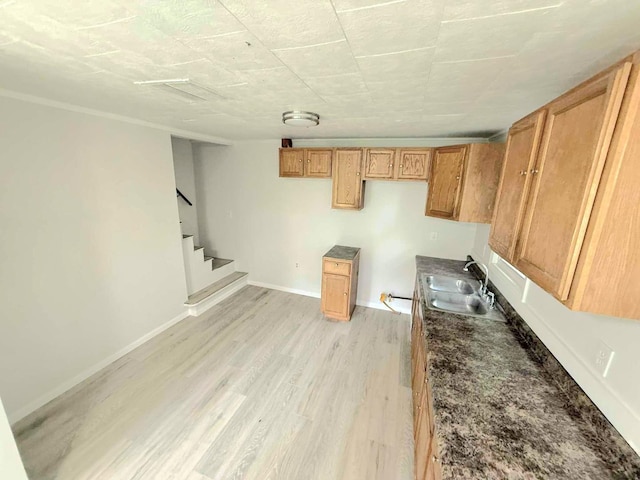1356 Willard Ave, Rockford, IL 61101 - kitchen featuring light wood-type flooring, brown cabinetry, and dark countertops