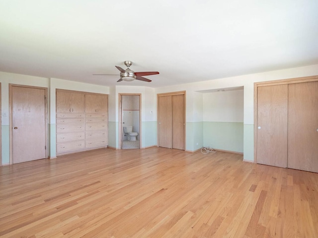 6052 W 128th St, Palos Heights, IL 60463 - unfurnished bedroom with two closets, light wood finished floors, ceiling fan, and ensuite bath