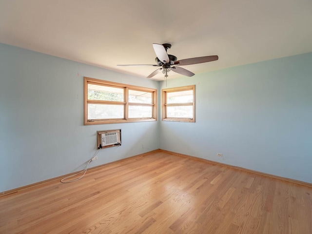 6052 W 128th St, Palos Heights, IL 60463 - spare room featuring a wall mounted air conditioner, plenty of natural light, light wood-type flooring, and ceiling fan