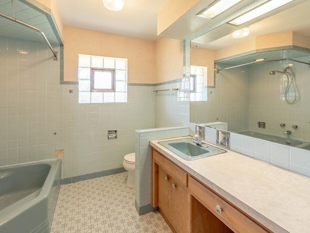 6052 W 128th St, Palos Heights, IL 60463 - bathroom with tile walls, vanity, shower / bath combination, and tile patterned floors