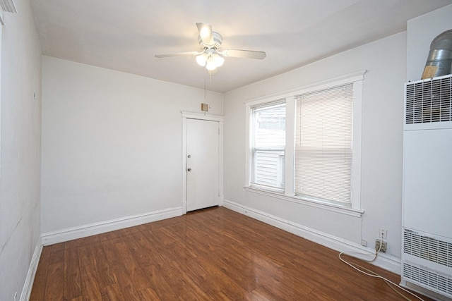 2834 S Union Ave, Chicago, IL 60616 - unfurnished room featuring a heating unit, wood finished floors, and ceiling fan