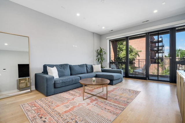 1011 N Winchester Ave Unit 2, Chicago, IL 60622 - living room with light wood finished floors and recessed lighting