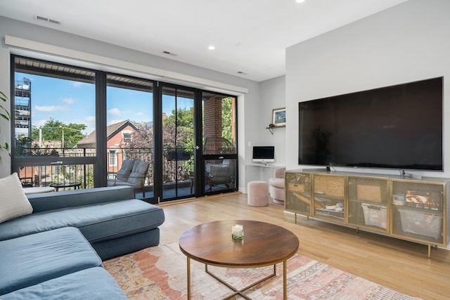 1011 N Winchester Ave Unit 2, Chicago, IL 60622 - living room with wood finished floors and recessed lighting