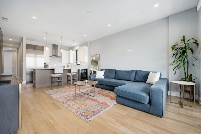 1011 N Winchester Ave Unit 2, Chicago, IL 60622 - living area featuring light wood finished floors, recessed lighting, and wine cooler