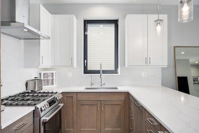 1011 N Winchester Ave Unit 2, Chicago, IL 60622 - kitchen with ventilation hood, stainless steel range with gas cooktop, light stone countertops, backsplash, and recessed lighting