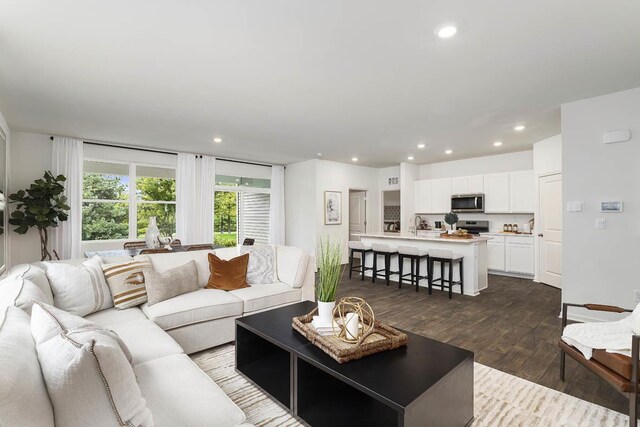 2281 Redwood Trl, Wonder Lake, IL 60097 - living room featuring dark wood-style floors and recessed lighting