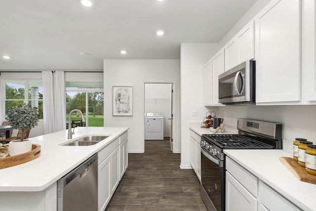 2281 Redwood Trl, Wonder Lake, IL 60097 - kitchen featuring appliances with stainless steel finishes, washer / clothes dryer, dark wood-style flooring, light countertops, and recessed lighting