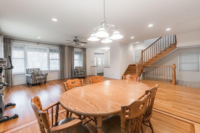 3723 N Nordica Ave, Chicago, IL 60634 - dining area with stairs, ceiling fan, light wood finished floors, a chandelier, and recessed lighting