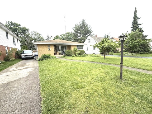 419 S Chase Ave, Lombard, IL 60148 - view of front of house with driveway, a front lawn, a porch, and brick siding