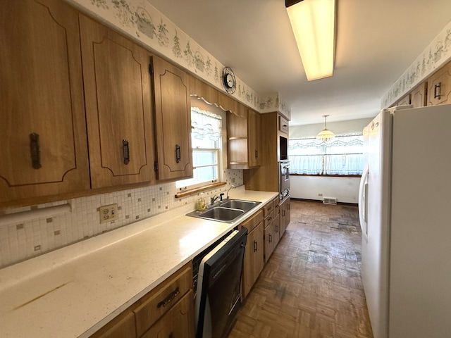 419 S Chase Ave, Lombard, IL 60148 - kitchen featuring freestanding refrigerator, dishwasher, plenty of natural light, and light countertops