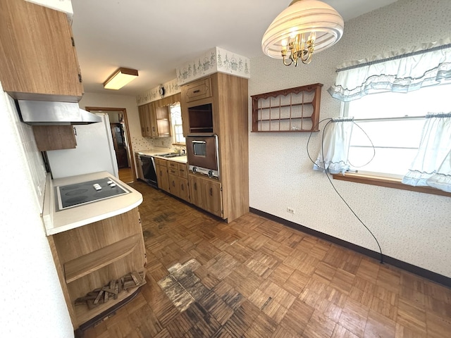 419 S Chase Ave, Lombard, IL 60148 - kitchen with wallpapered walls, extractor fan, light countertops, black appliances, and a chandelier