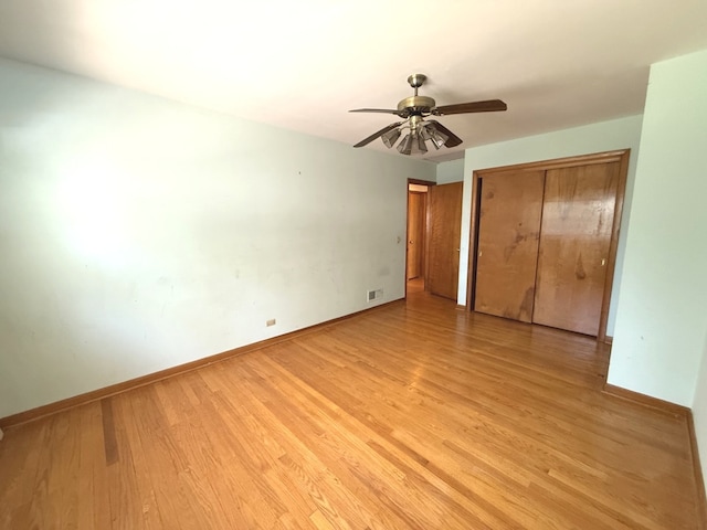 419 S Chase Ave, Lombard, IL 60148 - unfurnished bedroom with a closet, light wood-style flooring, and a ceiling fan