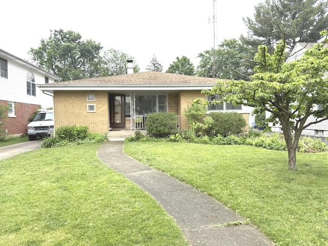 419 S Chase Ave, Lombard, IL 60148 - view of front of house with brick siding, covered porch, and a front yard
