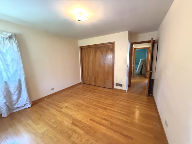419 S Chase Ave, Lombard, IL 60148 - unfurnished bedroom featuring light wood-type flooring and a closet