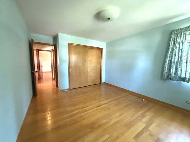 419 S Chase Ave, Lombard, IL 60148 - unfurnished bedroom featuring light wood-style flooring and a closet