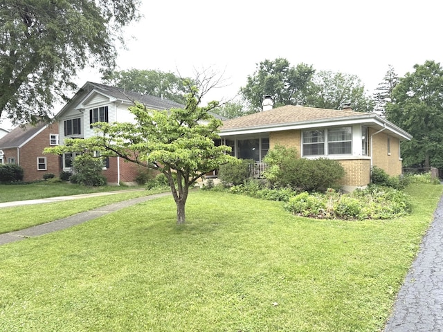 419 S Chase Ave, Lombard, IL 60148 - view of front of property with brick siding, a chimney, and a front yard
