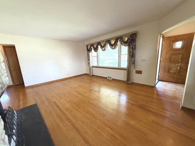 419 S Chase Ave, Lombard, IL 60148 - unfurnished living room featuring light wood-type flooring and baseboards