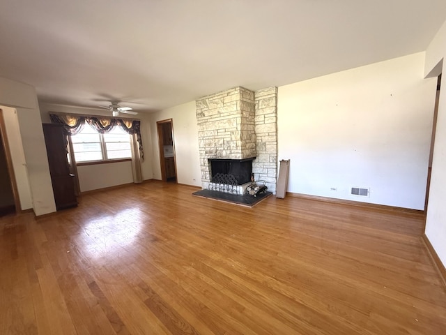 419 S Chase Ave, Lombard, IL 60148 - unfurnished living room with a fireplace, wood finished floors, and a ceiling fan