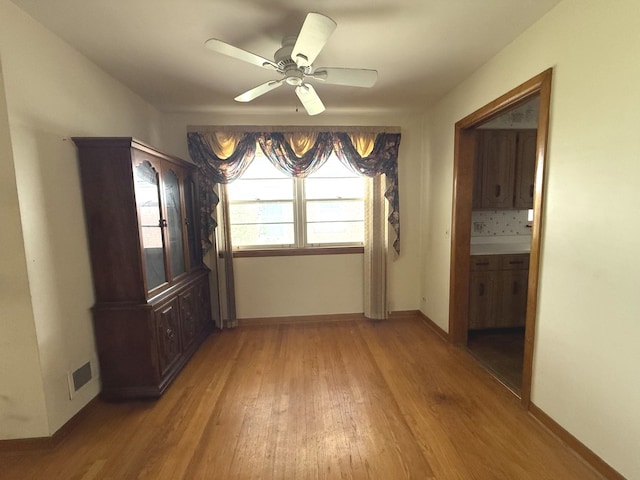 419 S Chase Ave, Lombard, IL 60148 - unfurnished dining area with light wood-style flooring and a ceiling fan