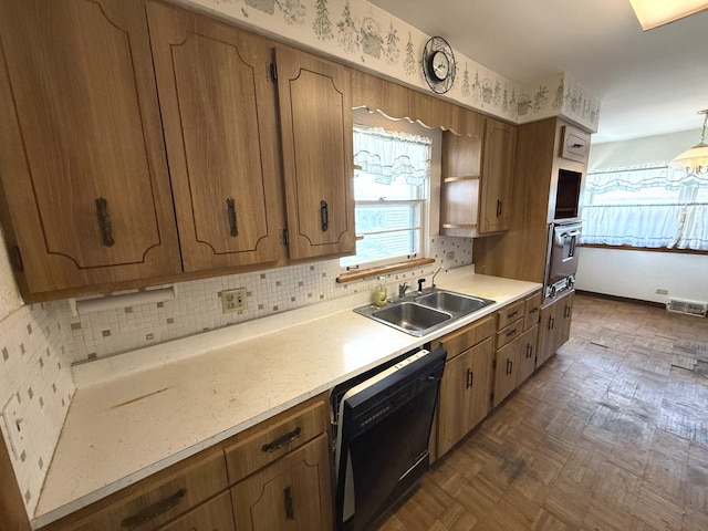 419 S Chase Ave, Lombard, IL 60148 - kitchen with black dishwasher, oven, light countertops, and brown cabinets