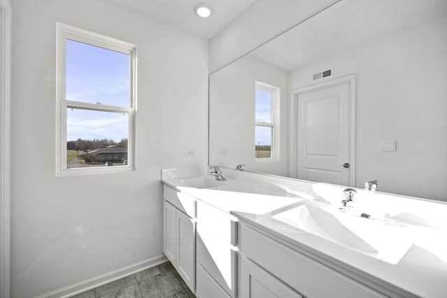 15063 W Oxford Ln, Manhattan, IL 60442 - bathroom featuring double vanity and marble look tiles