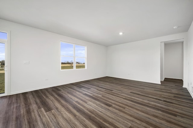 15063 W Oxford Ln, Manhattan, IL 60442 - empty room with plenty of natural light, dark wood-style flooring, and recessed lighting