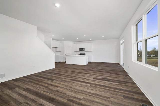 15063 W Oxford Ln, Manhattan, IL 60442 - unfurnished living room featuring dark wood-type flooring and recessed lighting