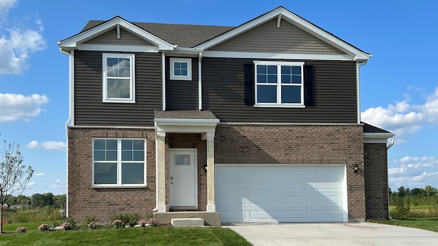 15103 W Oxford Ln, Manhattan, IL 60442 - view of front of house with brick siding, an attached garage, concrete driveway, and a shingled roof