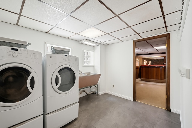 5943 N Talman Ave, Chicago, IL 60659 - washroom with washing machine and clothes dryer and tile patterned floors