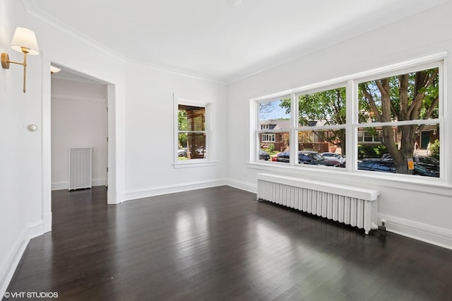 5943 N Talman Ave, Chicago, IL 60659 - unfurnished room with radiator heating unit, dark wood-type flooring, and crown molding