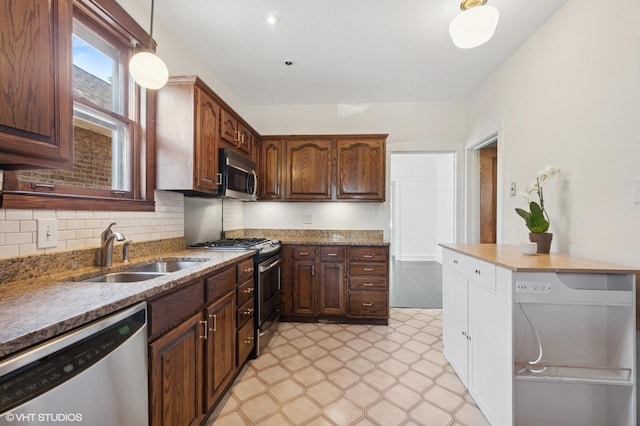 5943 N Talman Ave, Chicago, IL 60659 - kitchen with appliances with stainless steel finishes, tasteful backsplash, light stone countertops, and pendant lighting