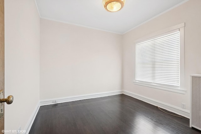 5943 N Talman Ave, Chicago, IL 60659 - empty room with crown molding, dark wood finished floors, and radiator heating unit