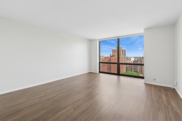 2650 N Lakeview Ave Unit 1603, Chicago, IL 60614 - unfurnished room featuring dark wood finished floors, a wall of windows, and a view of city