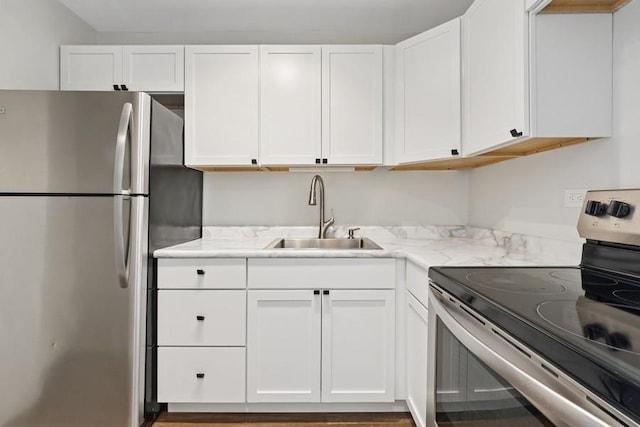 2650 N Lakeview Ave Unit 1603, Chicago, IL 60614 - kitchen featuring stainless steel appliances, white cabinets, and light stone counters