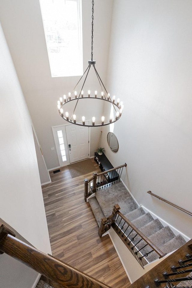 26550 W Old Stage Ln, Channahon, IL 60410 - staircase featuring wood finished floors and a chandelier