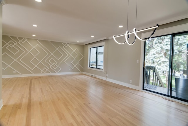 40 Portwine Rd, Willowbrook, IL 60527 - empty room with plenty of natural light, crown molding, recessed lighting, and light wood finished floors