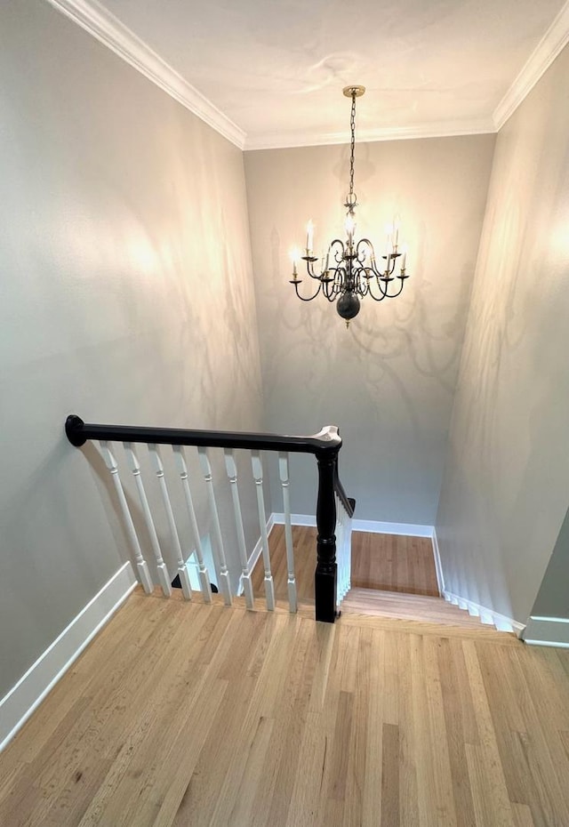 40 Portwine Rd, Willowbrook, IL 60527 - staircase featuring wood finished floors, a chandelier, and ornamental molding