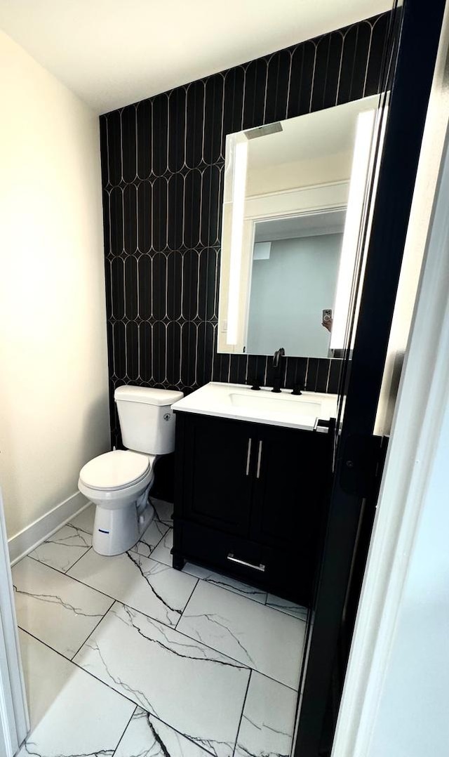 40 Portwine Rd, Willowbrook, IL 60527 - half bathroom with marble look tiles and vanity