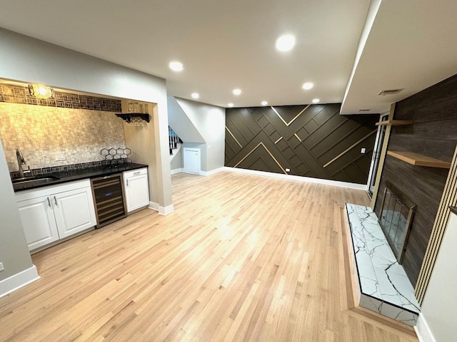 40 Portwine Rd, Willowbrook, IL 60527 - indoor dry bar with beverage cooler, decorative backsplash, light wood-style flooring, stairs, and recessed lighting