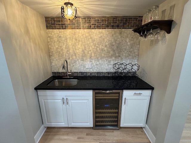 40 Portwine Rd, Willowbrook, IL 60527 - bar with beverage cooler, backsplash, and light wood-type flooring