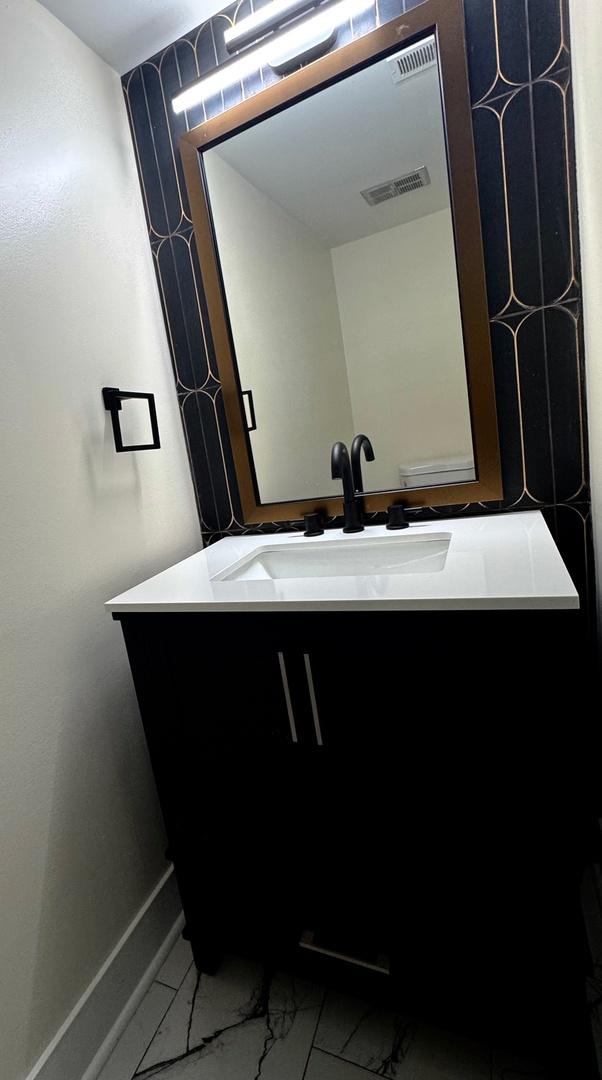40 Portwine Rd, Willowbrook, IL 60527 - bathroom featuring vanity and marble finish floors