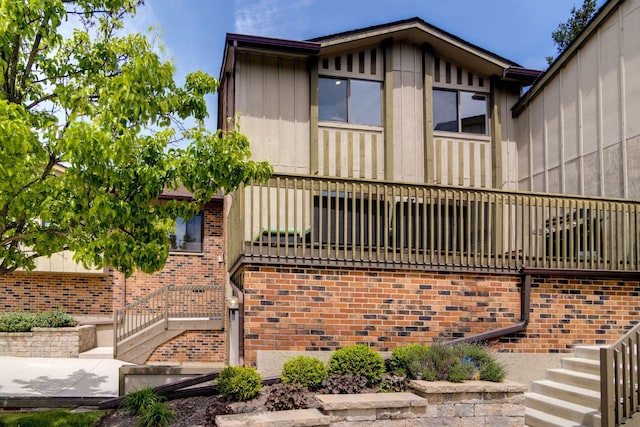 40 Portwine Rd, Willowbrook, IL 60527 - view of home's exterior with stairway and board and batten siding