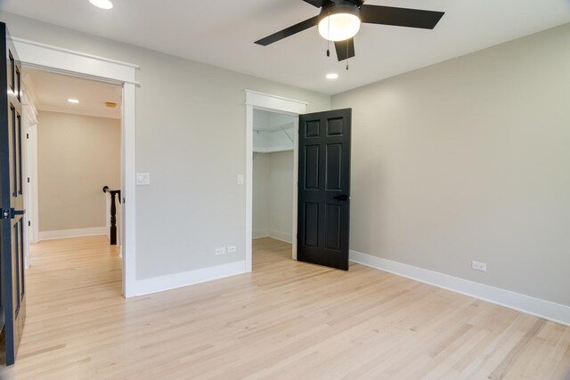 40 Portwine Rd, Willowbrook, IL 60527 - unfurnished bedroom featuring light wood finished floors, recessed lighting, a walk in closet, ceiling fan, and a closet
