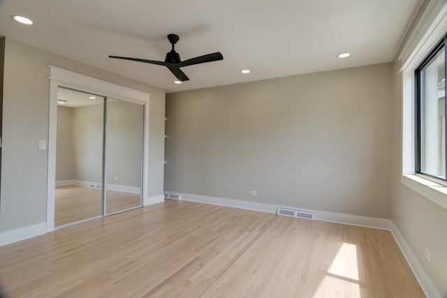 40 Portwine Rd, Willowbrook, IL 60527 - unfurnished bedroom featuring multiple windows, light wood finished floors, recessed lighting, a closet, and a ceiling fan