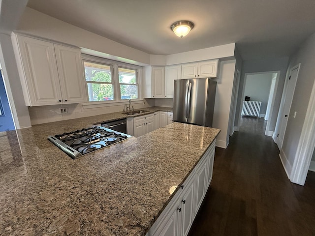 261 N Evergreen Ave, Elmhurst, IL 60126 - kitchen featuring stainless steel appliances, stone countertops, white cabinetry, dark wood finished floors, and a peninsula