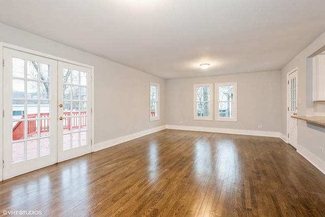 261 N Evergreen Ave, Elmhurst, IL 60126 - unfurnished living room with dark wood finished floors and french doors